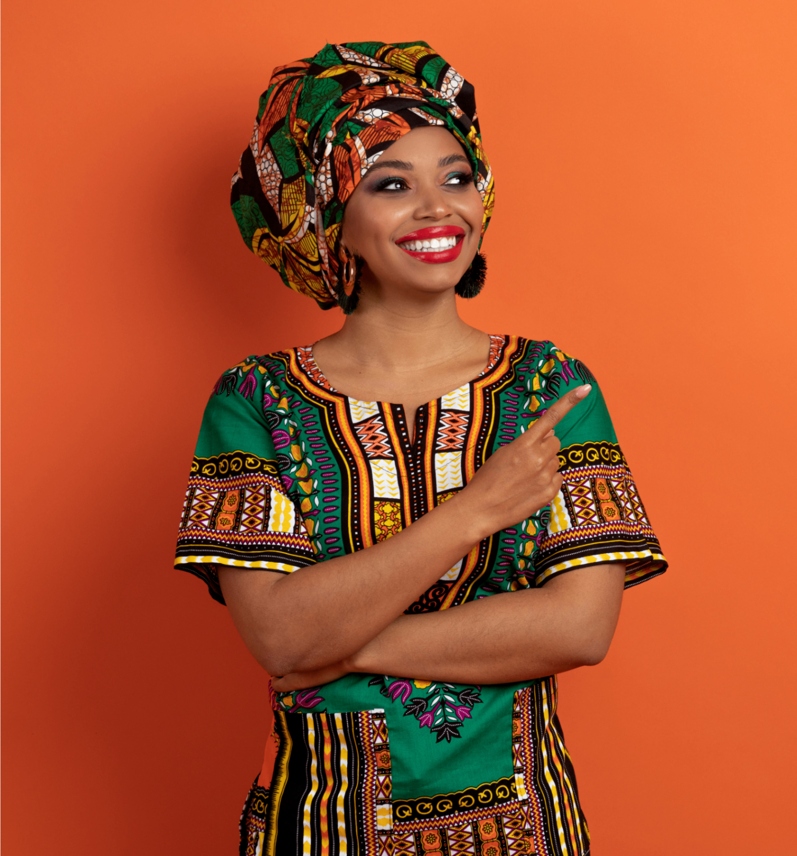 A Muslim woman in vibrant African print smiling joyfully